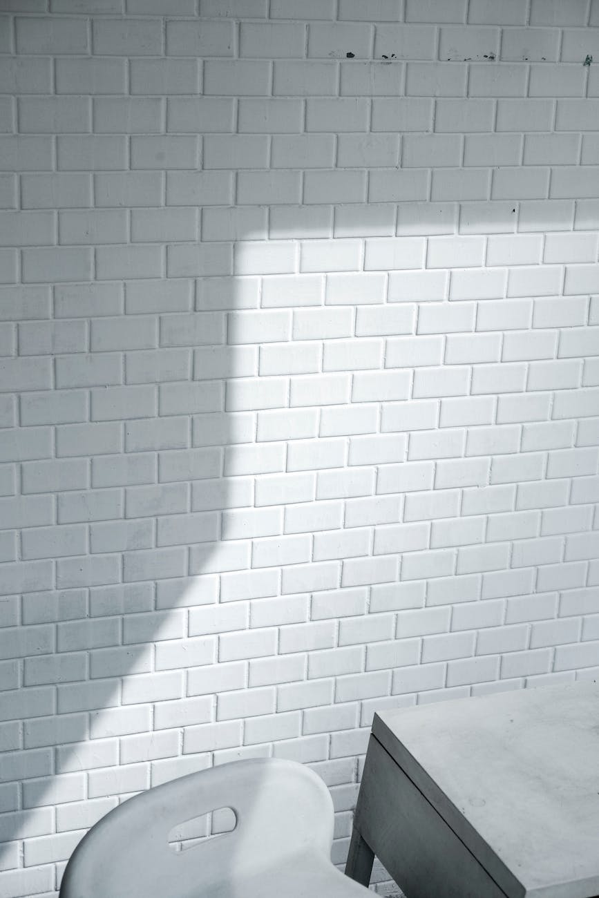 White brick wall near white chair in white room for Anton Chico experiment.